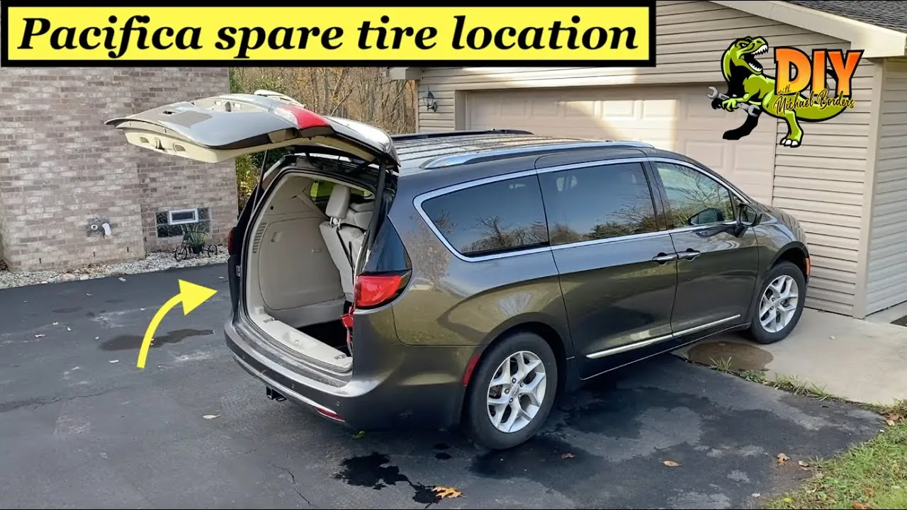 A car jack is placed on a flat surface with a stabilizing board.