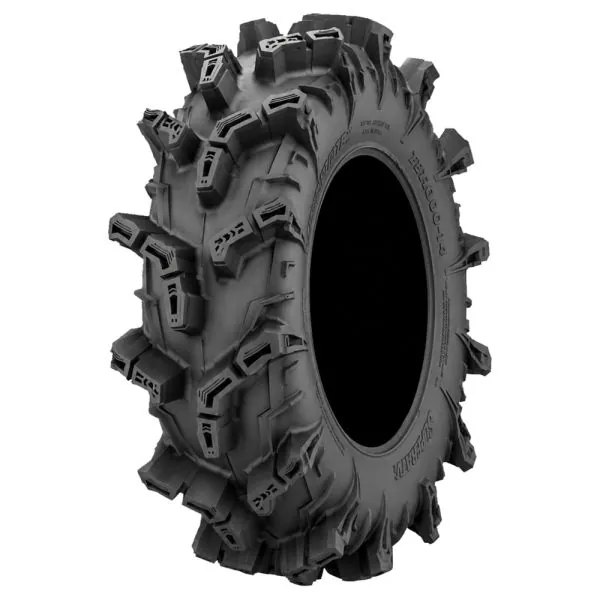 Detailed view of a lightweight 4-ply ATV mud tire in a workshop.