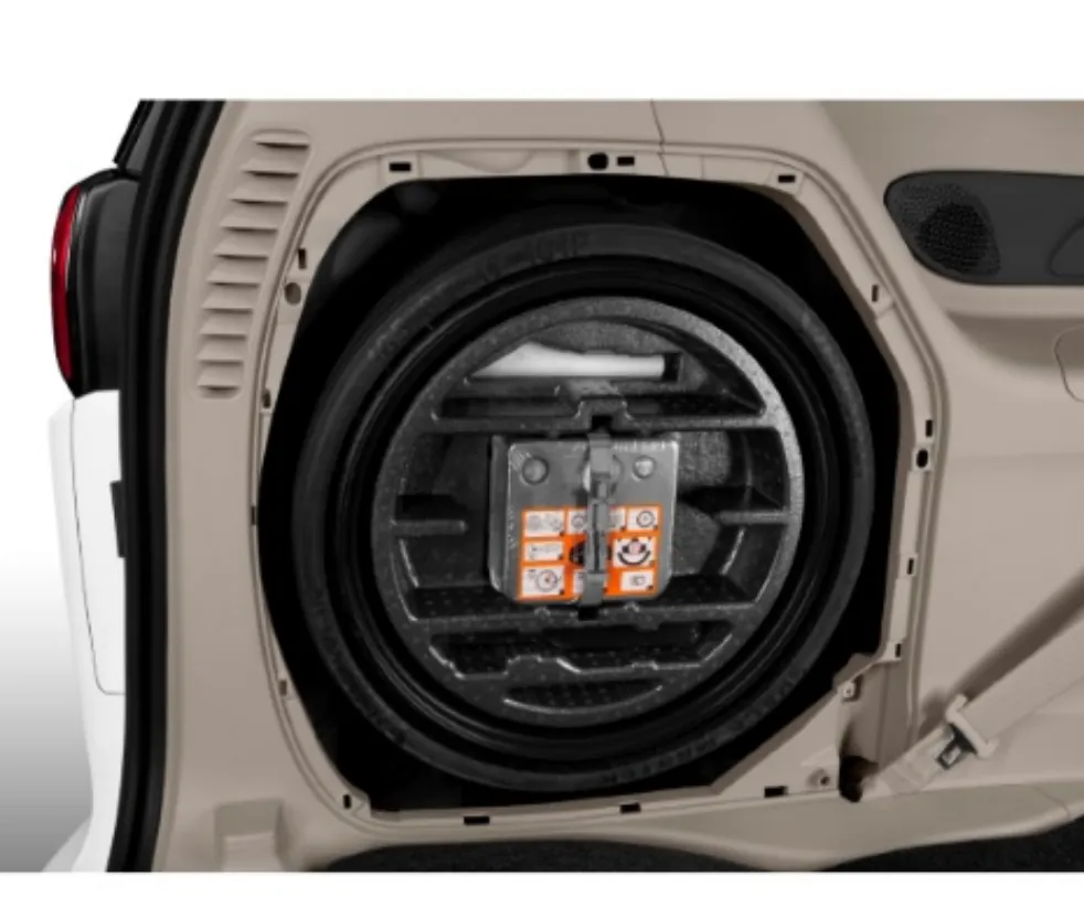 The spare tire compartment is revealed under the floor of the Chrysler Pacifica.
